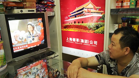 Man watches TV in China