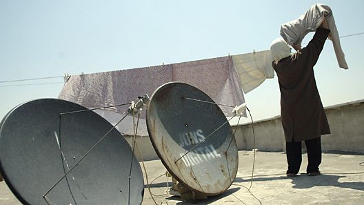 Satellite aerials on a roof-top in Iran